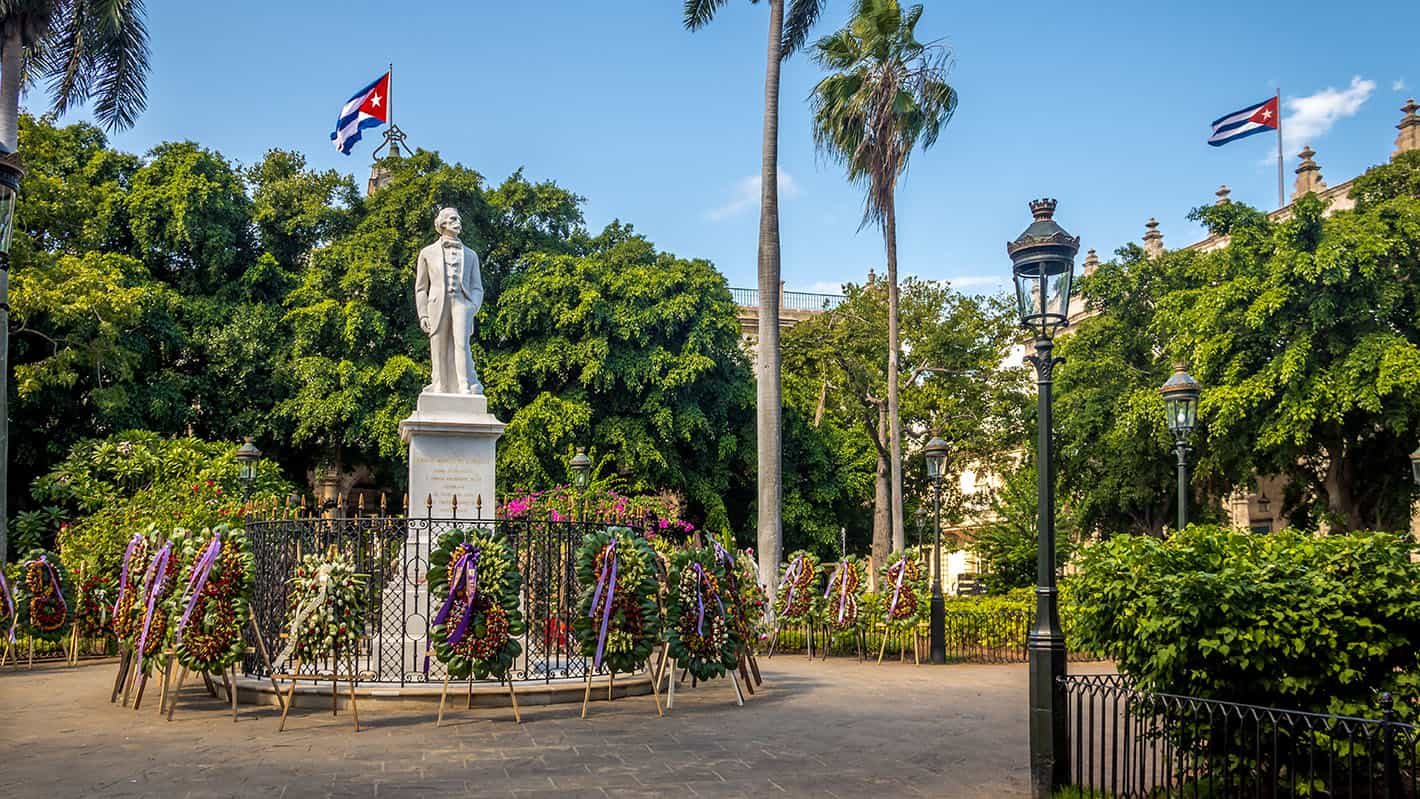 Havana City Tour - Old Havana top attractions: Carlos Manuel de Cespedes white marble statue in the middle of Plaza de Armas in Old Havana